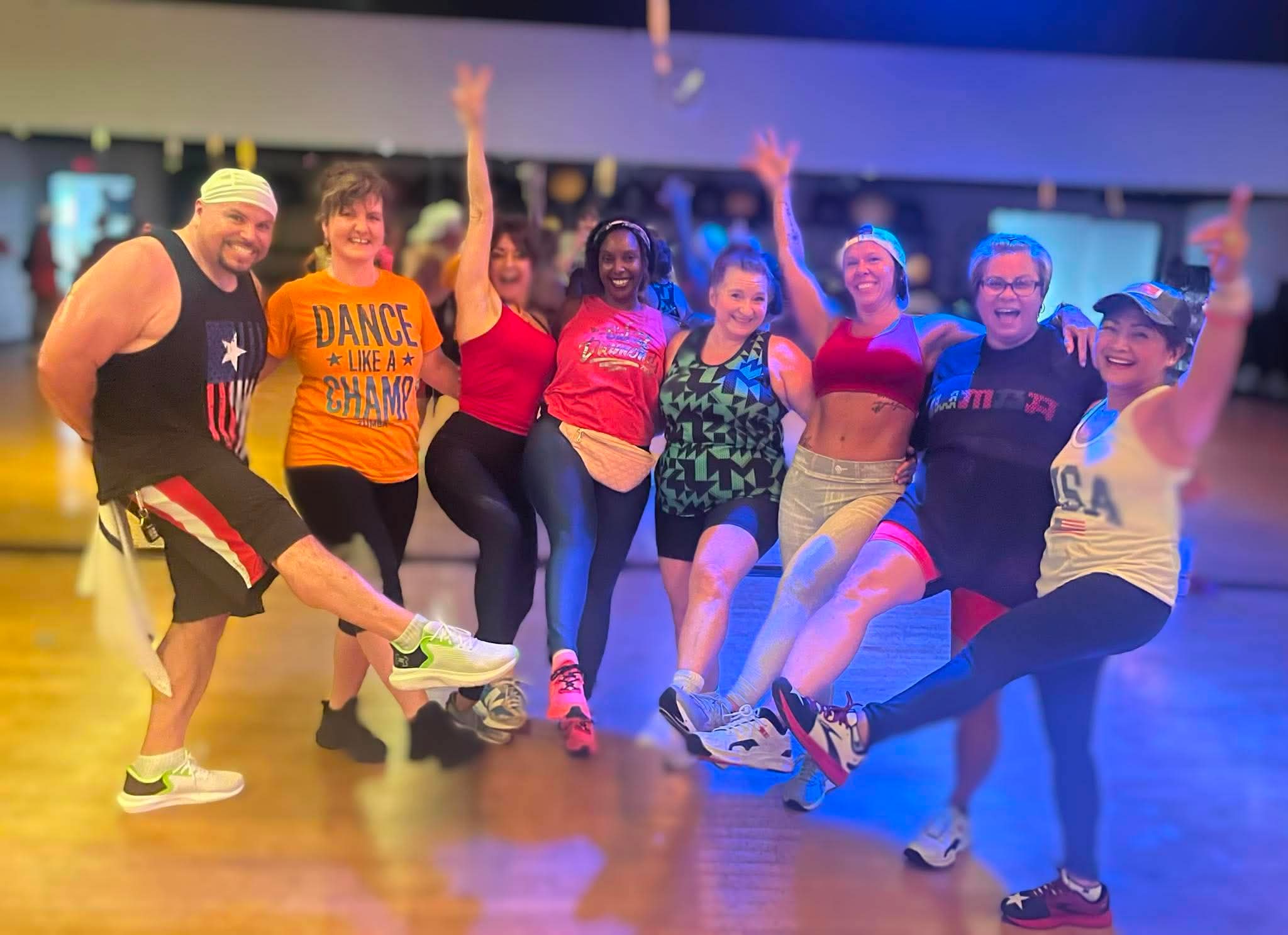 Unity in Motion instructors and participants celebrating after a fitness class